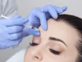 woman getting botox in her forehead